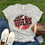 a shirt that says tigers with a football and a pair of jeans